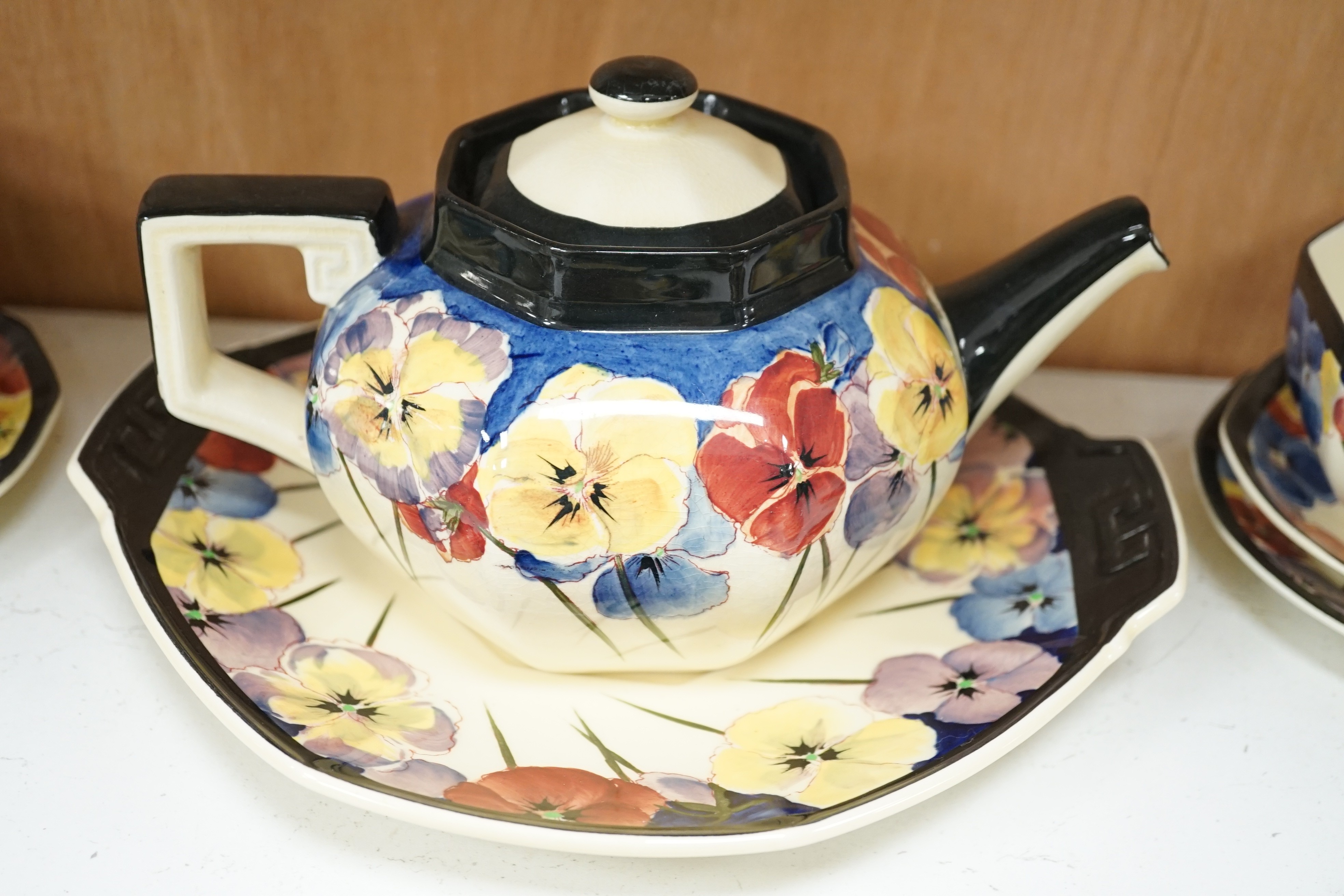 A Doulton “pansy” design tea set, marked on base D4049, Reg no:597783